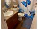 Bathroom features a vanity and toilet with accessories, plus modern wood floors at 2750 S Durango Dr # 2141, Las Vegas, NV 89117