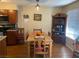 Charming dining area with wood table, hutch, and ample natural light at 2750 S Durango Dr # 2141, Las Vegas, NV 89117