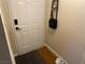 Neutral entryway featuring a white door with a smart lock and dark hardware at 2750 S Durango Dr # 2141, Las Vegas, NV 89117