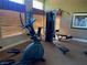 Gym space featuring a stationary bike and weight machine, with natural light coming from nearby windows at 2750 S Durango Dr # 2141, Las Vegas, NV 89117