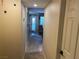 Neutral hallway leading to a seating area, with a door on the right at 2750 S Durango Dr # 2141, Las Vegas, NV 89117