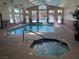 Indoor pool and hot tub area with ample lighting, creating a relaxing atmosphere for residents at 2750 S Durango Dr # 2141, Las Vegas, NV 89117