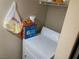 The laundry area includes a white washing machine and shelf storage at 2750 S Durango Dr # 2141, Las Vegas, NV 89117