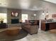 Cozy living room with a stone fireplace, comfortable seating, and an adjacent dining area for relaxation at 2750 S Durango Dr # 2141, Las Vegas, NV 89117