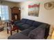 Cozy living room with a fireplace, corner hutch, and comfortable sofa at 2750 S Durango Dr # 2141, Las Vegas, NV 89117