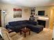 Comfortable living room features cozy seating, decor, and a fireplace at 2750 S Durango Dr # 2141, Las Vegas, NV 89117