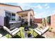 Enjoy a private backyard featuring a relaxing hot tub, patio, lush artificial grass, and a seating area perfect for entertaining at 2845 Mincio St, Henderson, NV 89044