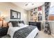 Cozy bedroom featuring a queen bed, decorative wall art, and a dark wood dresser at 2845 Mincio St, Henderson, NV 89044