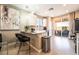 Modern kitchen with white cabinets, sleek countertops, and bar seating, perfect for casual dining at 2845 Mincio St, Henderson, NV 89044