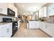 Bright, modern kitchen with stainless steel appliances and a seamless flow to the cozy living area at 2845 Mincio St, Henderson, NV 89044