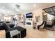 Open concept living area with contemporary decor, featuring a fireplace, plush seating, and natural light at 2845 Mincio St, Henderson, NV 89044
