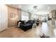Bright living room featuring modern furniture, stylish decor, and sleek hardwood floors for comfortable living at 2845 Mincio St, Henderson, NV 89044
