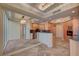 Elegant kitchen featuring modern appliances, granite countertops, and natural wood cabinetry at 2877 Paradise Rd # 2105, Las Vegas, NV 89109