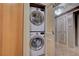 Compact laundry closet with modern stacked washer and dryer at 2877 Paradise Rd # 2105, Las Vegas, NV 89109