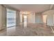 Bright living room with tile flooring, modern lighting, and large windows showcasing views of the city at 2877 Paradise Rd # 2105, Las Vegas, NV 89109