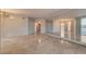Open living room with polished tile flooring, mirrored wall, and windows providing abundant natural light at 2877 Paradise Rd # 2105, Las Vegas, NV 89109