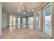 Expansive living room with sleek tile flooring, a large mirror, and panoramic city views through floor-to-ceiling windows at 2877 Paradise Rd # 2105, Las Vegas, NV 89109