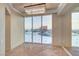 Inviting living room showcases sleek tile flooring, a modern chandelier, and a wide window overlooking the city at 2877 Paradise Rd # 2105, Las Vegas, NV 89109