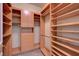 Walk-in closet featuring custom wood shelving at 2877 Paradise Rd # 2105, Las Vegas, NV 89109
