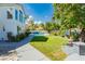 Expansive backyard with a well-manicured lawn, patio, and a glimpse of the sparkling pool at 2920 Sterling Cove Dr, Las Vegas, NV 89128