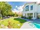 Lush backyard featuring a well-maintained lawn, patio area, pool with a built-in spa at 2920 Sterling Cove Dr, Las Vegas, NV 89128