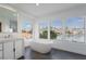 Bathroom featuring a modern tub and vanity with lakeside views at 2920 Sterling Cove Dr, Las Vegas, NV 89128