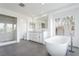 Bathroom with a freestanding tub, glass shower, and double sink vanity at 2920 Sterling Cove Dr, Las Vegas, NV 89128