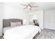 Bright bedroom featuring a large window, neutral tones, carpeted floors, and modern furnishings at 2920 Sterling Cove Dr, Las Vegas, NV 89128