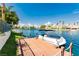 Scenic waterfront home with a boat docked at a private pier, offering direct water access at 2920 Sterling Cove Dr, Las Vegas, NV 89128