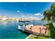 Waterfront property featuring a private boat dock and boat with access to a scenic waterway at 2920 Sterling Cove Dr, Las Vegas, NV 89128