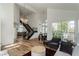Open-concept entryway with high ceilings, hardwood floors, and elegant chandelier at 2920 Sterling Cove Dr, Las Vegas, NV 89128