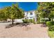 Beautiful two-story home featuring a tile roof, three-car garage, and well-manicured desert landscaping at 2920 Sterling Cove Dr, Las Vegas, NV 89128