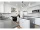 Modern kitchen featuring stainless steel appliances, stone countertops, and ample storage at 2920 Sterling Cove Dr, Las Vegas, NV 89128