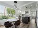 Modern kitchen with stainless steel appliances, an island, and an adjacent dining area with a large window at 2920 Sterling Cove Dr, Las Vegas, NV 89128