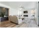 Spacious living room with a modern fireplace, large windows, comfortable seating, and stylish decor at 2920 Sterling Cove Dr, Las Vegas, NV 89128