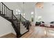 Bright living room featuring natural light, modern furniture, and stairway at 2920 Sterling Cove Dr, Las Vegas, NV 89128
