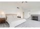 Spacious bedroom with fireplace, sitting area, and neutral decor at 2920 Sterling Cove Dr, Las Vegas, NV 89128