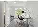 Well-lit office space with a modern desk, chair, and comfortable sofa at 2920 Sterling Cove Dr, Las Vegas, NV 89128