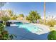 Sparkling pool with a built-in spa, surrounded by lush landscaping and a sunny patio area at 2920 Sterling Cove Dr, Las Vegas, NV 89128