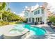 Stunning backyard pool with a spa, surrounded by a spacious patio and mature trees at 2920 Sterling Cove Dr, Las Vegas, NV 89128