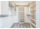 Organized walk-in closet with shelving and hanging rods at 2920 Sterling Cove Dr, Las Vegas, NV 89128