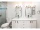 Bright bathroom featuring double sinks, glass shower, and modern finishes at 3060 Tarpon Dr # 104, Las Vegas, NV 89120