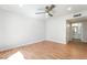 Spacious bedroom with a ceiling fan and a door leading to a bathroom at 3060 Tarpon Dr # 104, Las Vegas, NV 89120