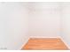 Walk-in closet with wood floor and shelving; ready for ample storage at 3060 Tarpon Dr # 104, Las Vegas, NV 89120