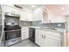 Modern kitchen featuring stainless steel appliances and stylish backsplash at 3060 Tarpon Dr # 104, Las Vegas, NV 89120