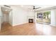 Bright living room with hardwood floors, fireplace, and sliding doors to the patio at 3060 Tarpon Dr # 104, Las Vegas, NV 89120
