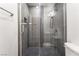 Bathroom shower featuring dark tile and modern finishes at 3060 Tarpon Dr # 104, Las Vegas, NV 89120