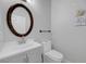 Updated bathroom boasts a modern vanity, toilet, and decorative wall art at 3079 Evening Mist Ave, Henderson, NV 89052