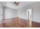 Large bedroom with hardwood floors, ceiling fan, and ensuite bathroom access at 3079 Evening Mist Ave, Henderson, NV 89052