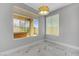 Open living room area showcasing a window with a view and marble floors with recessed lighting at 3079 Evening Mist Ave, Henderson, NV 89052